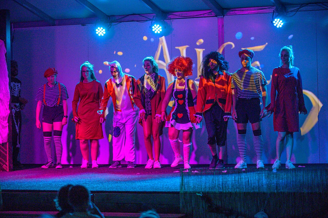 Costumed show on stage with performers at CAPFUN Mirabelle campsite, VOLSTROFF (57).