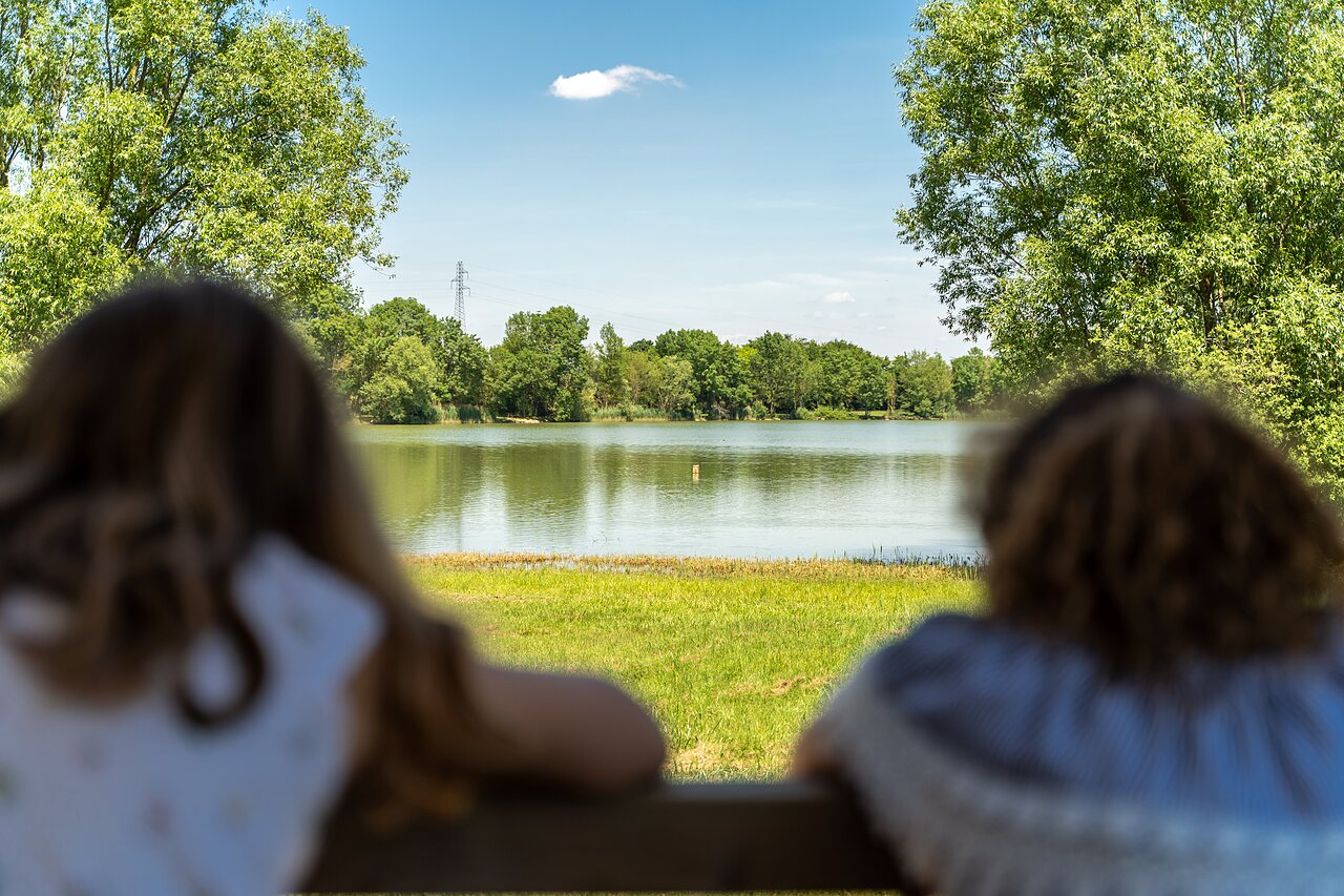 Peaceful lake, trees, people enjoying scenic view at CAPFUN Mirabelle, VOLSTROFF (57).