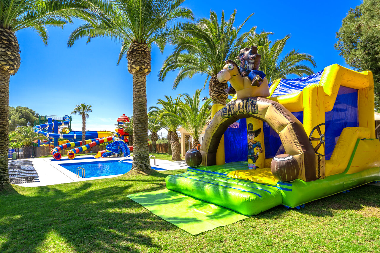 Inflatable Saloon castle, water slides, pool at CAPFUN Mirmanda campsite Cambrils.