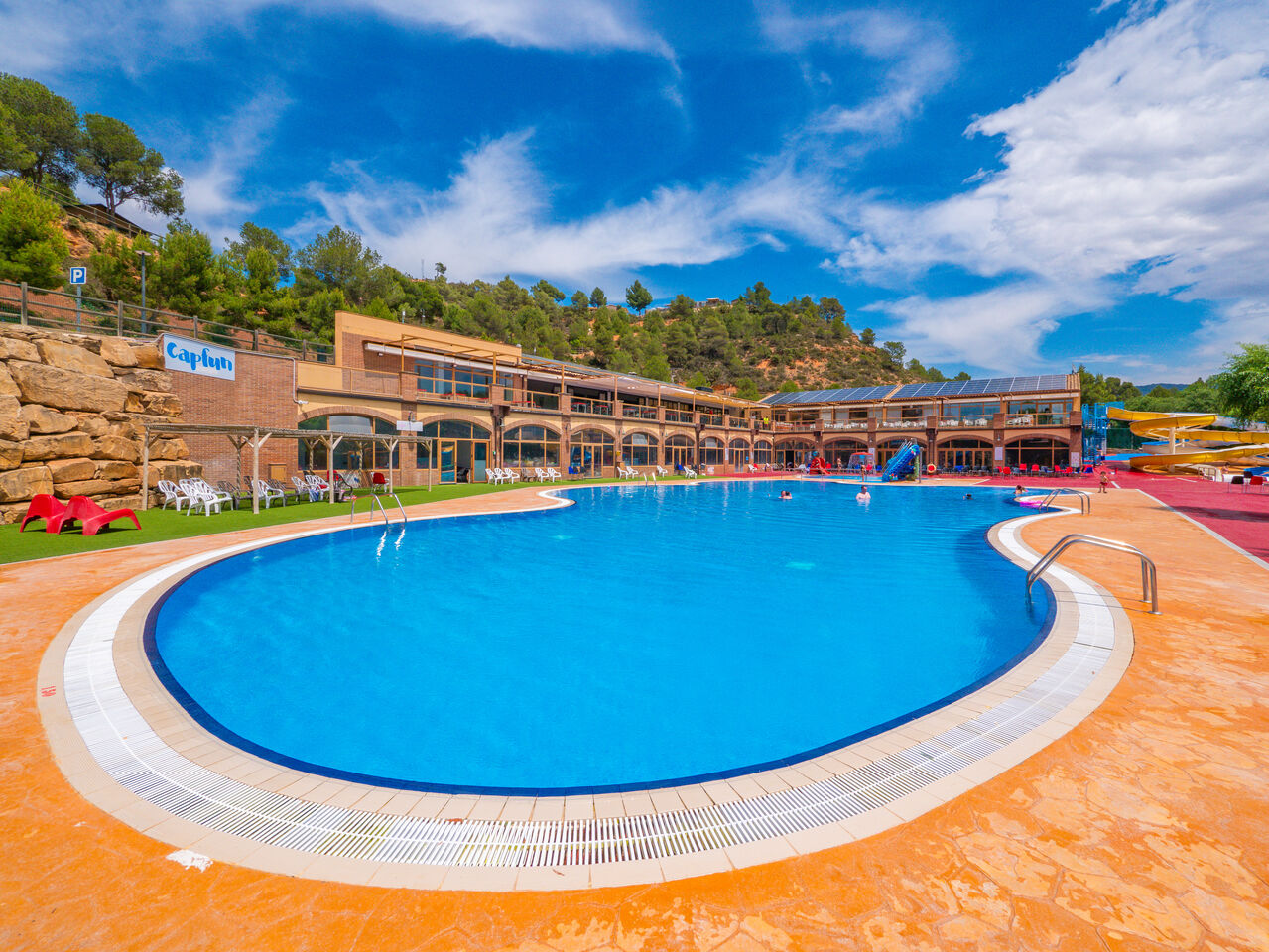 Outdoor pool, water slides and main building at CAPFUN Montblanc Park, Montblanc (43).