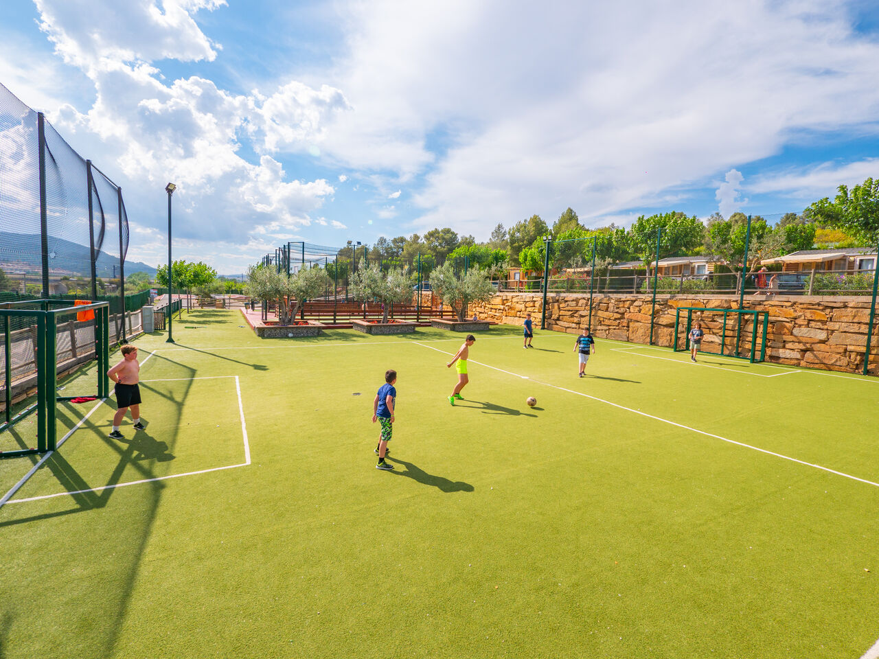 Kids playing football on multisport field, Mobile homes at CAPFUN Montblanc Park (43).