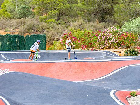 Modern pump track for scooters and bikes at CAPFUN Montblanc Park campsite.