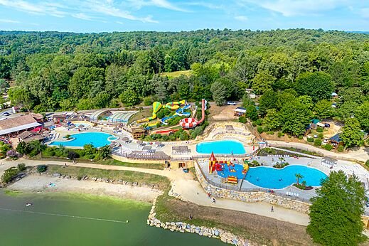 Aerial view of the water park, pools and slides at CAPFUN Moulinal campsite in BIRON (24).