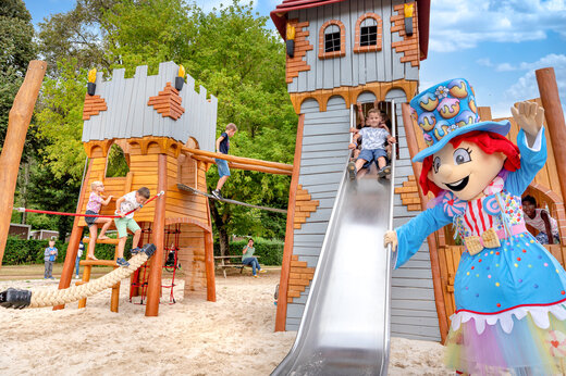 Castle playground, slide and mascot at CLICOCHIC Moulin du Roch campsite in Saint Andre D'Allas (24).