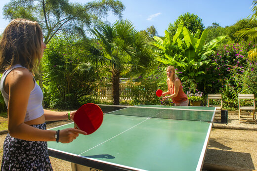 Outdoor table tennis game at camping CLICOCHIC Moulin du Roch in Saint Andre D'Allas.