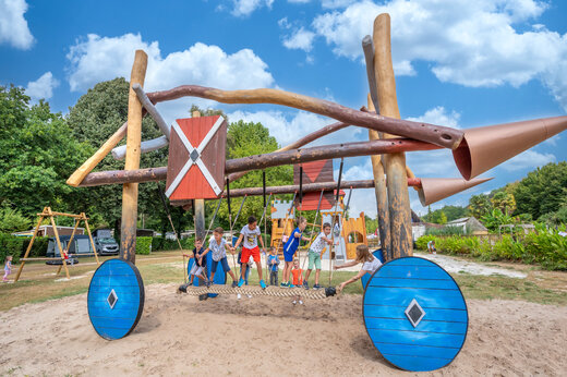 Wooden playground for children at CLICOCHIC Moulin du Roch campsite in Saint Andre D'Allas.