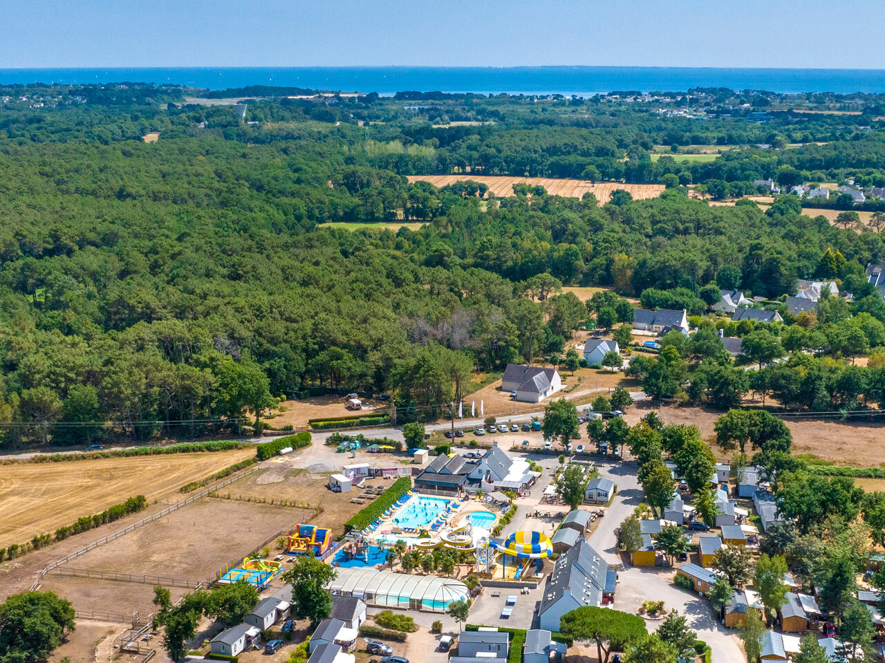 Aerial view of the water park and Mobile homes at VAGUES OCEANES Moustoir campsite in Carnac (56).