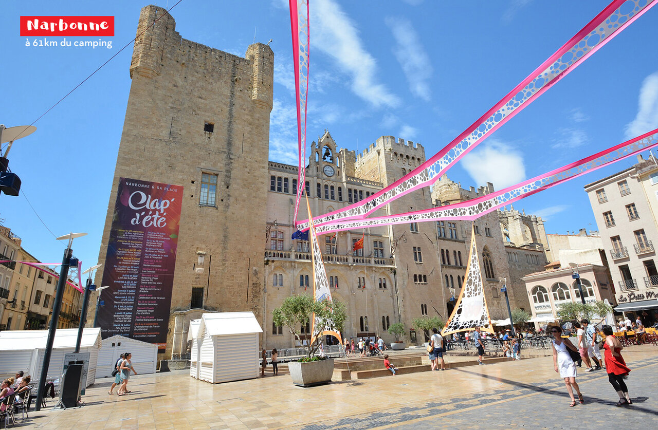 Archbishop's Palace and lively square in Narbonne, historic city in Occitanie.