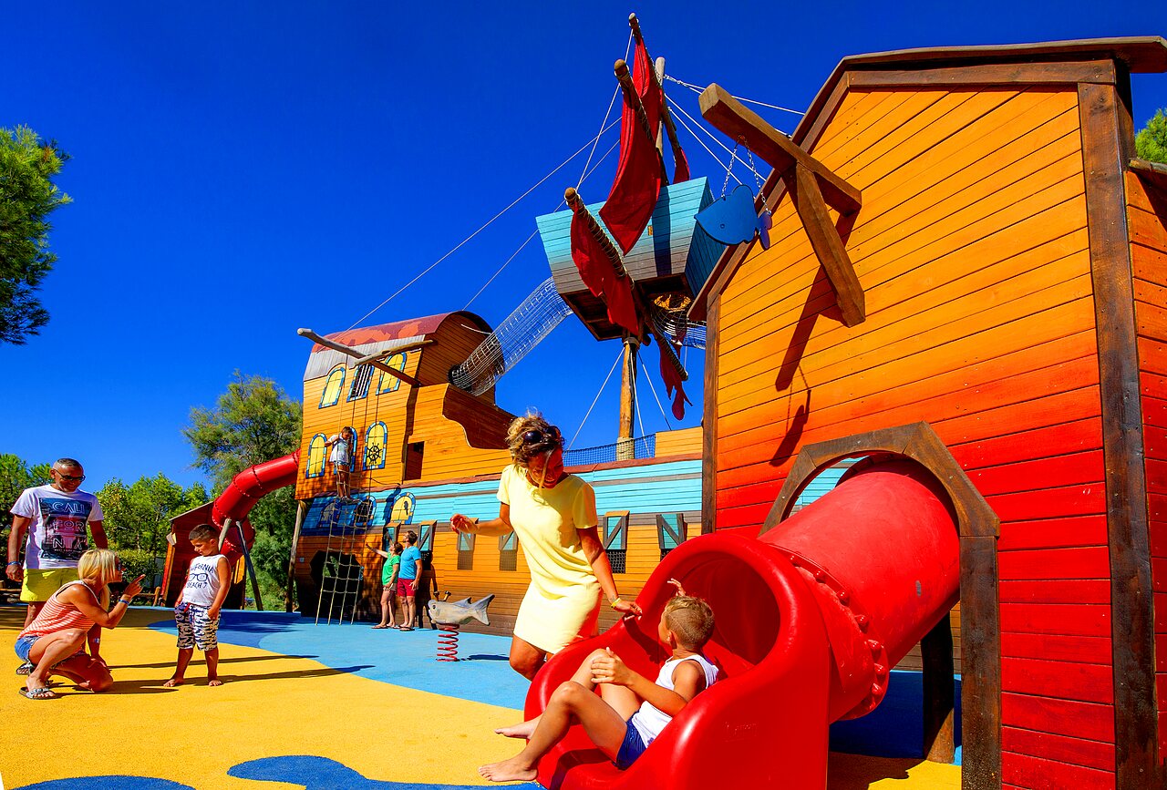 Themed playground, slide, children at CAPFUN La Nina campsite in Agde (34).