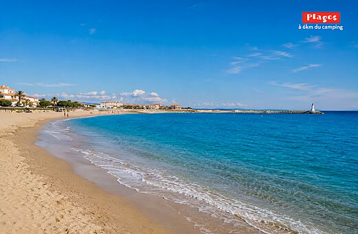 Fine sandy beach, turquoise sea, lighthouse at CAPFUN La Nina Agde campsite.