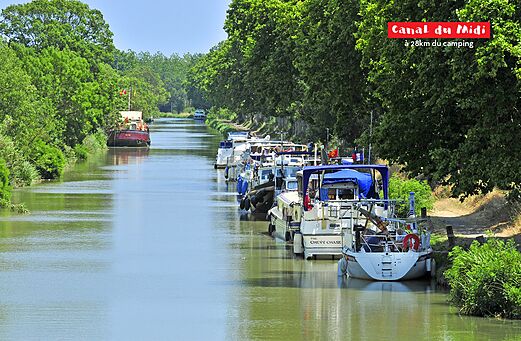 Canal du Midi, historic waterway with boats, near Agde in Occitania.