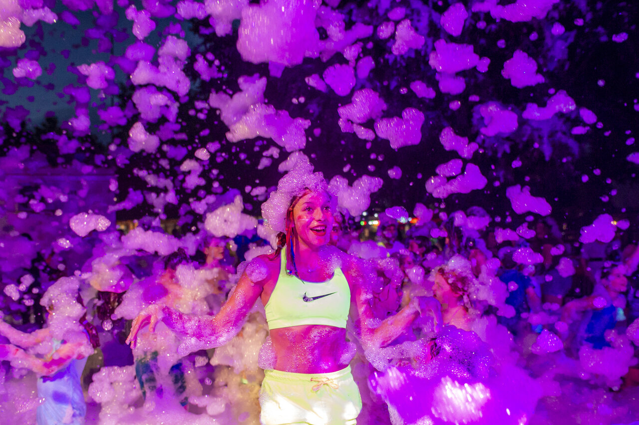 Smiling young woman foam party CAPFUN Ondines campsite in Vias Plage (34).