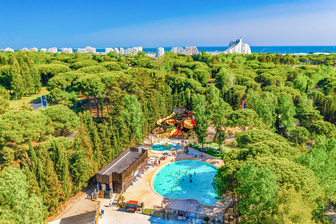 Aerial view of water park with slides and pools at CAPFUN Or campsite in La Grande Motte (34).