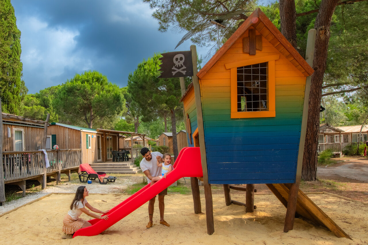 Family enjoying the playground at CAPFUN Or campsite La Grande Motte.