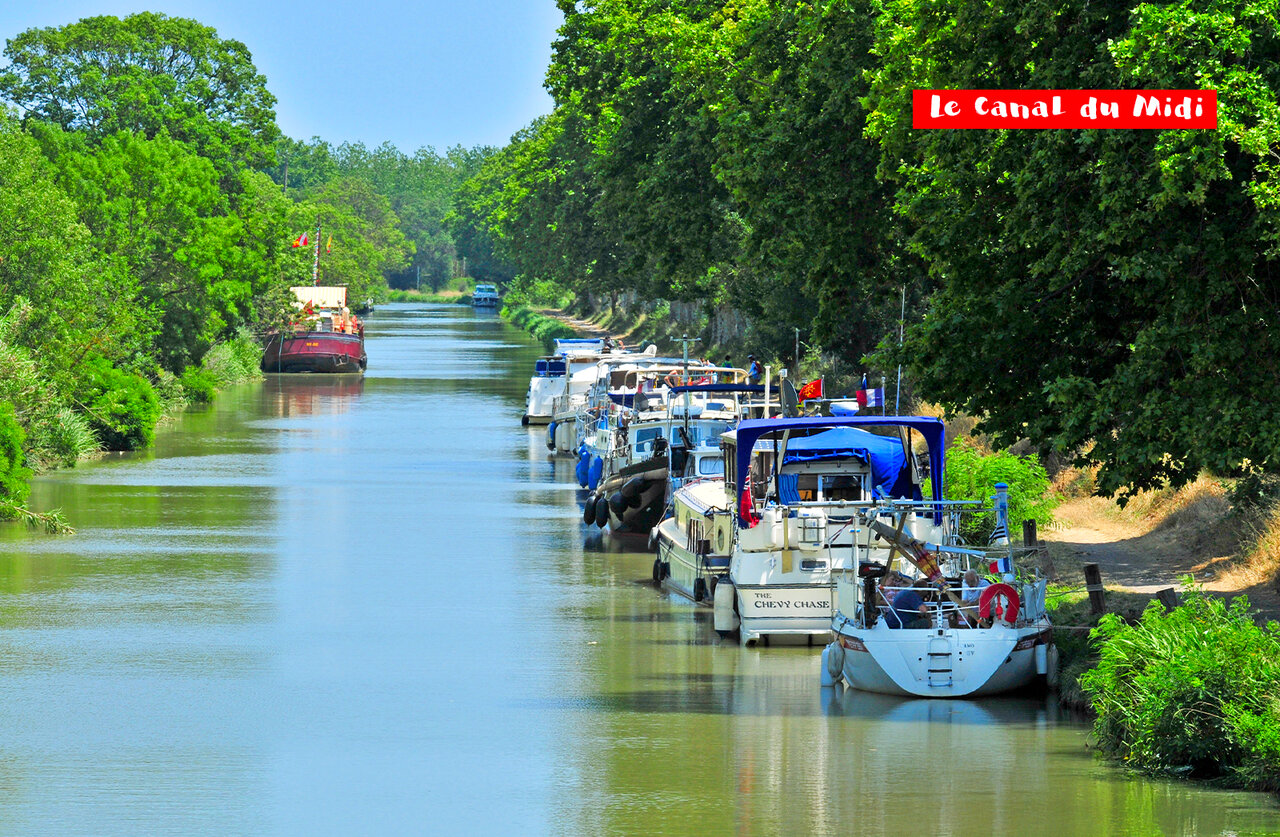 Boats moored on the Canal du Midi, a tourist spot to visit near the campsite.
