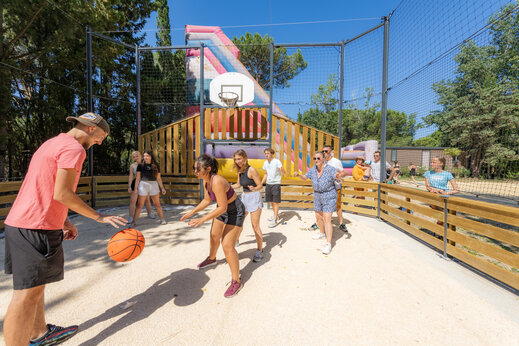 Basketball court and inflatable game at CAPFUN Or campsite, La Grande Motte (34).
