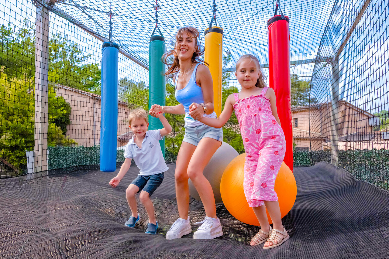 Giant trampoline with children and adult at CLICOCHIC Or�e d'Azur campsite in OPIO.