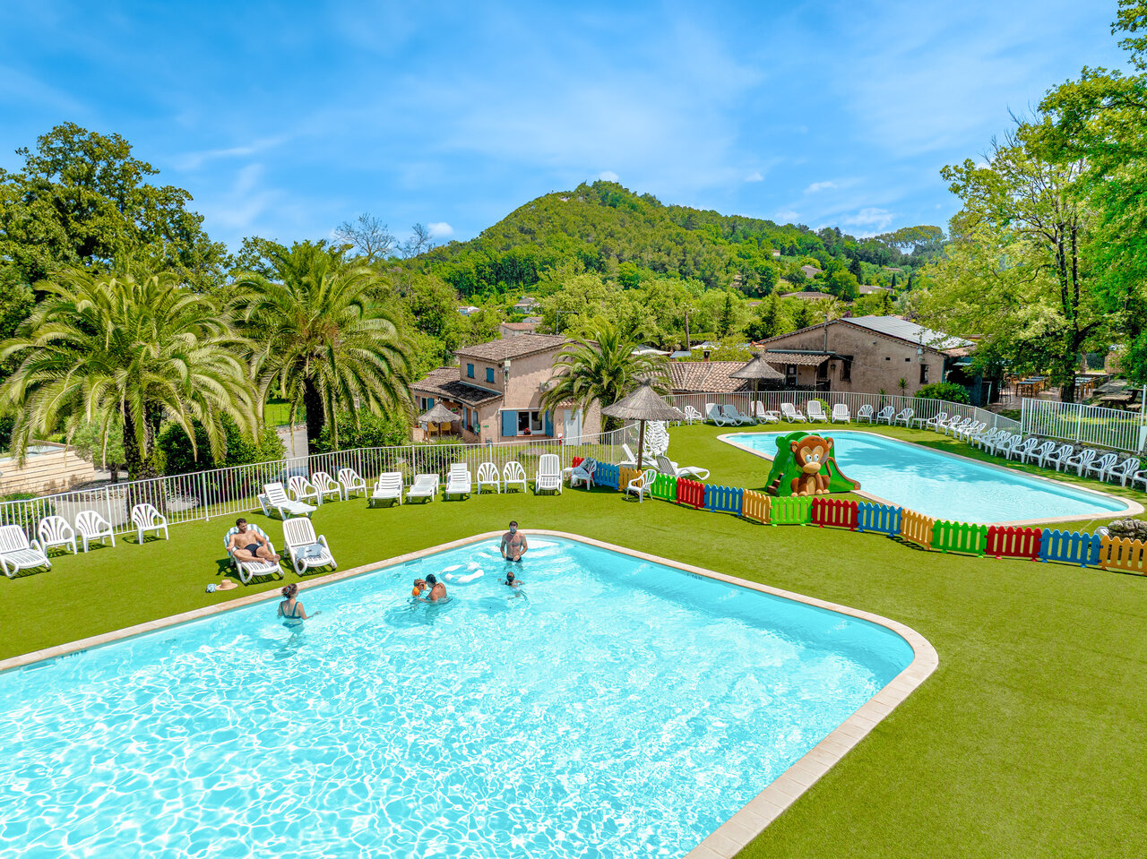 Outdoor pools, children's pool and slide at CLICOCHIC Or�e d'Azur campsite in OPIO (06).