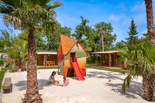 Playground, playhouse and slide at CLICOCHIC Or�e d'Azur campsite in OPIO (06).