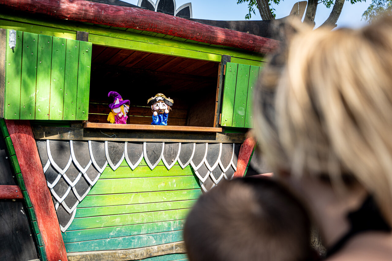 Puppet show with witch and pirate on colorful stage at CAPFUN Oursi�re campsite in Villard de Lans (38).