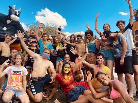 Smiling young adults, colorful entertainment at CAPFUN Oursi�re campsite.