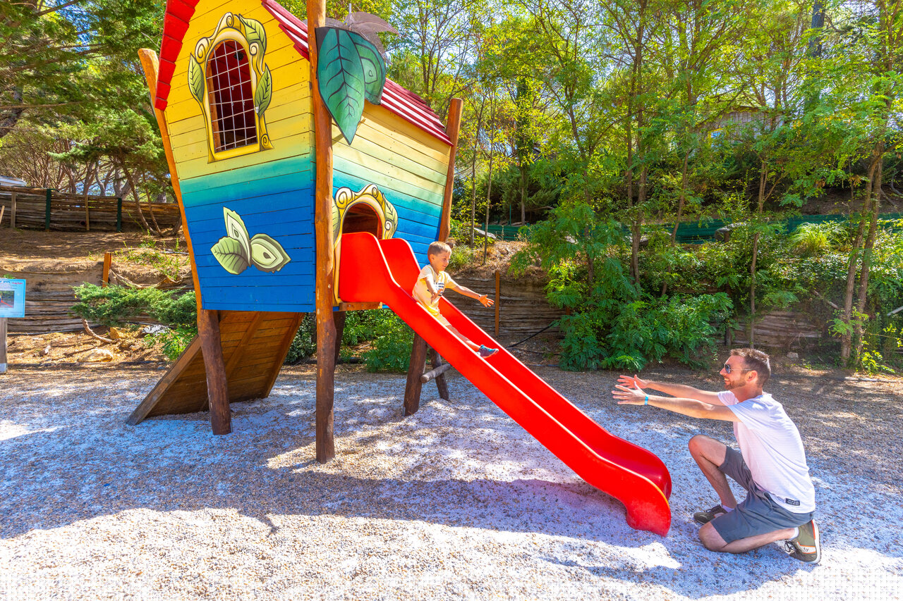 Slide, playhouse, games at CAPFUN Pachacaid campsite in La Mole (83).