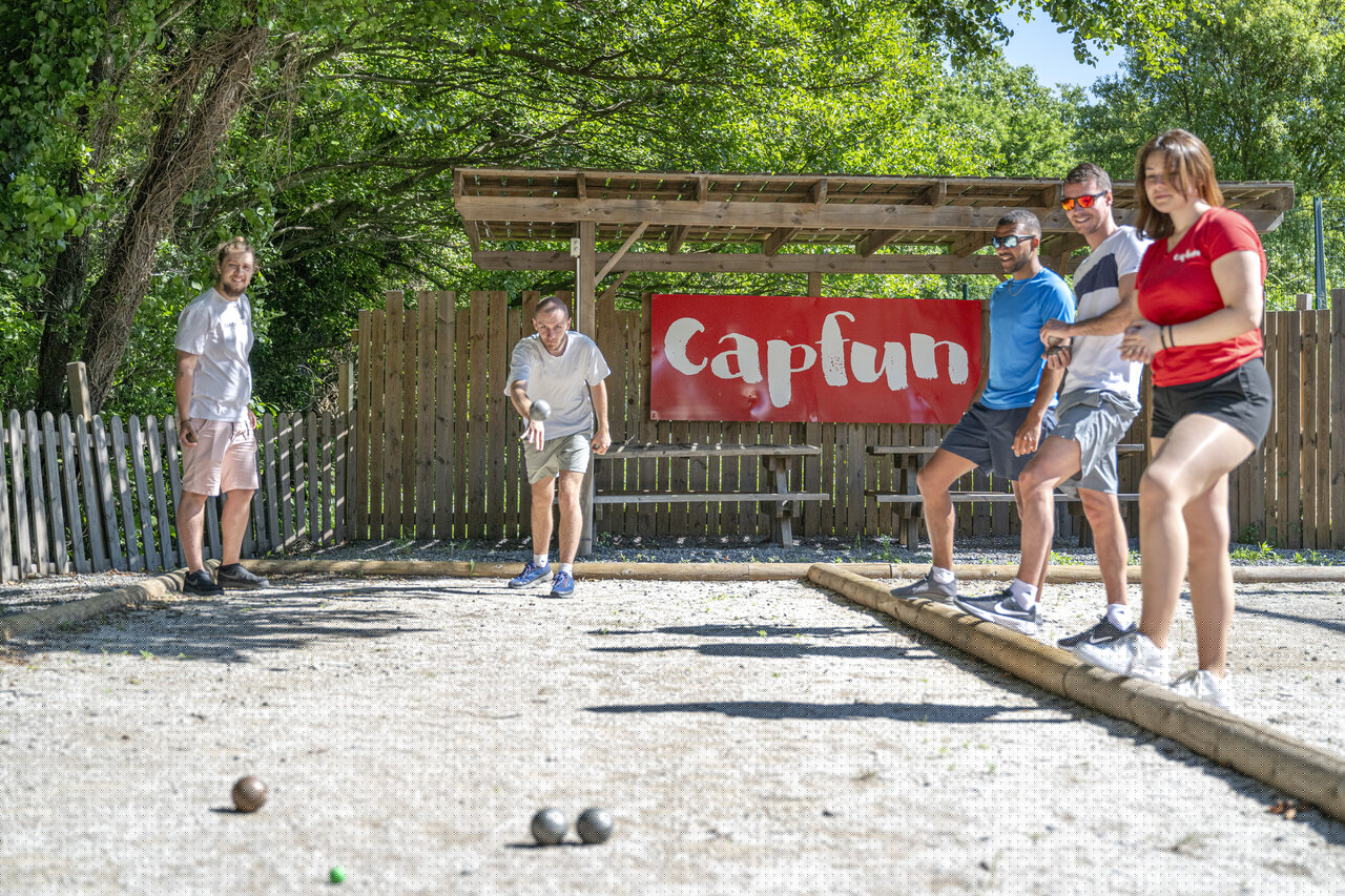 Adults playing p�tanque at CAPFUN Pachacaid campsite, La Mole (83).