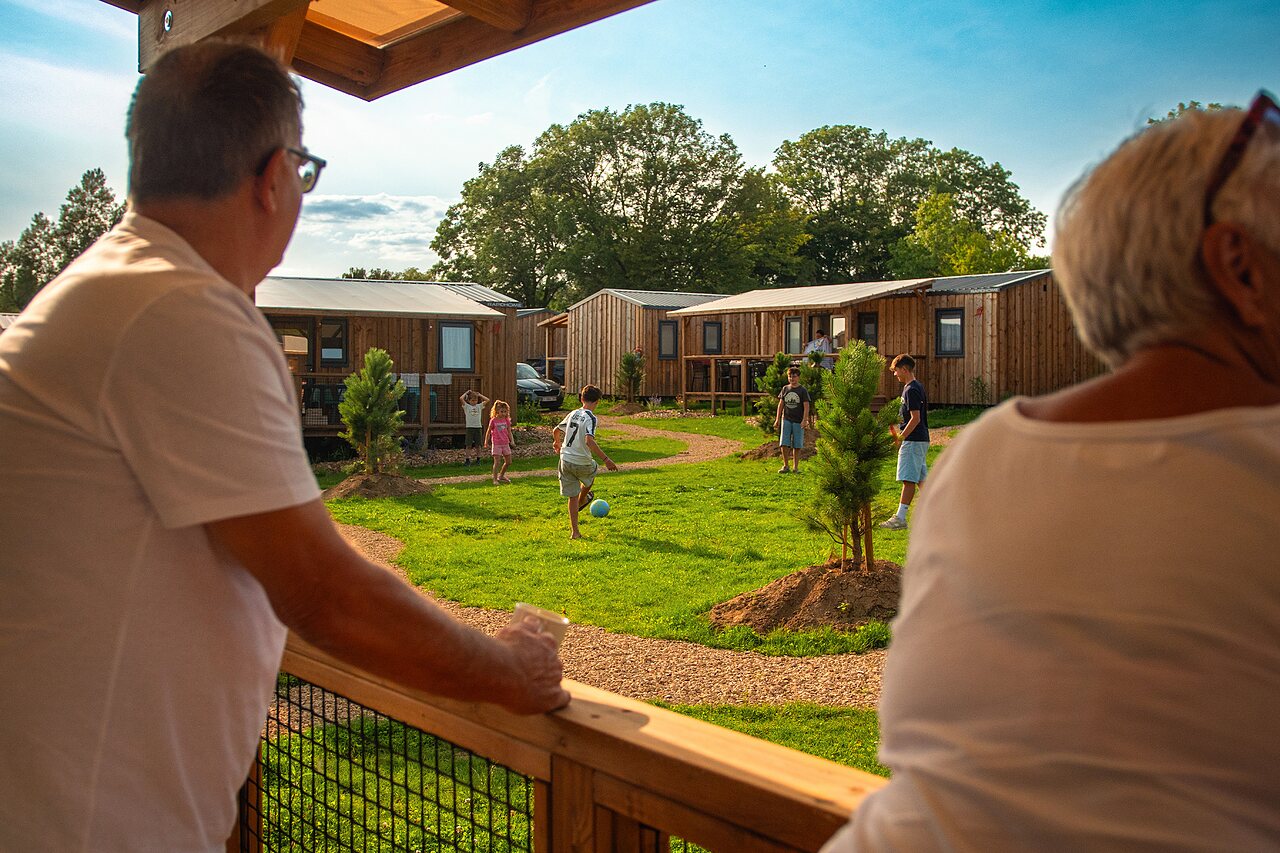 Mobile-homes, children playing football at CAPFUN Pachy campsite in FOSSES LA VILLE.