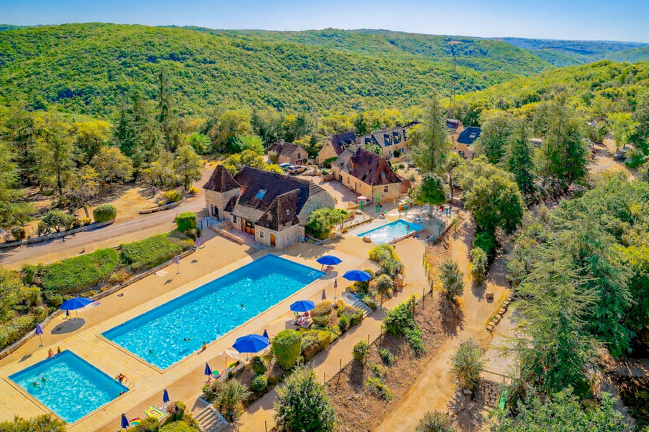 Aerial view outdoor pools, buildings, VAGUES OCEANES Paille Basse campsite, Souillac (46).