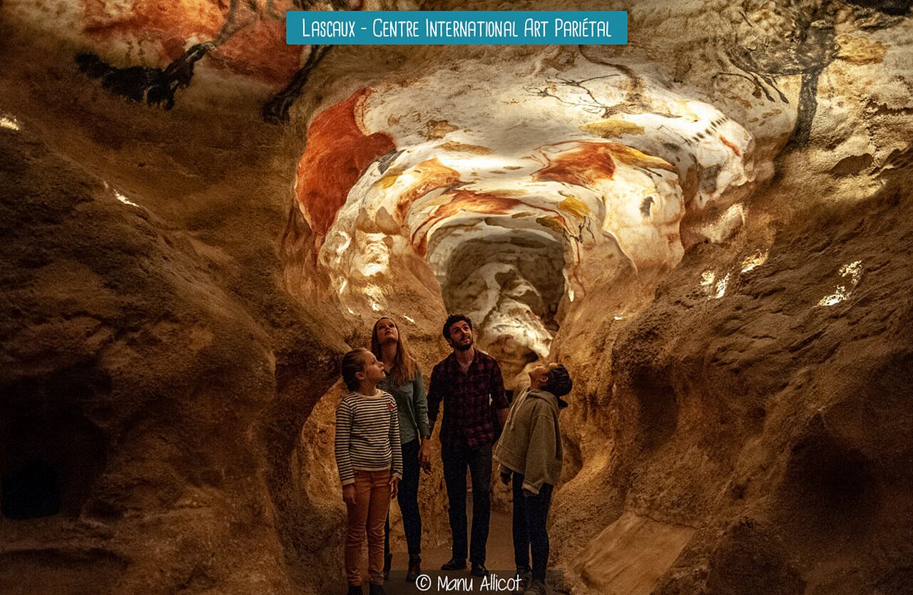 Family visiting Lascaux cave, major prehistoric site in the Dordogne region.