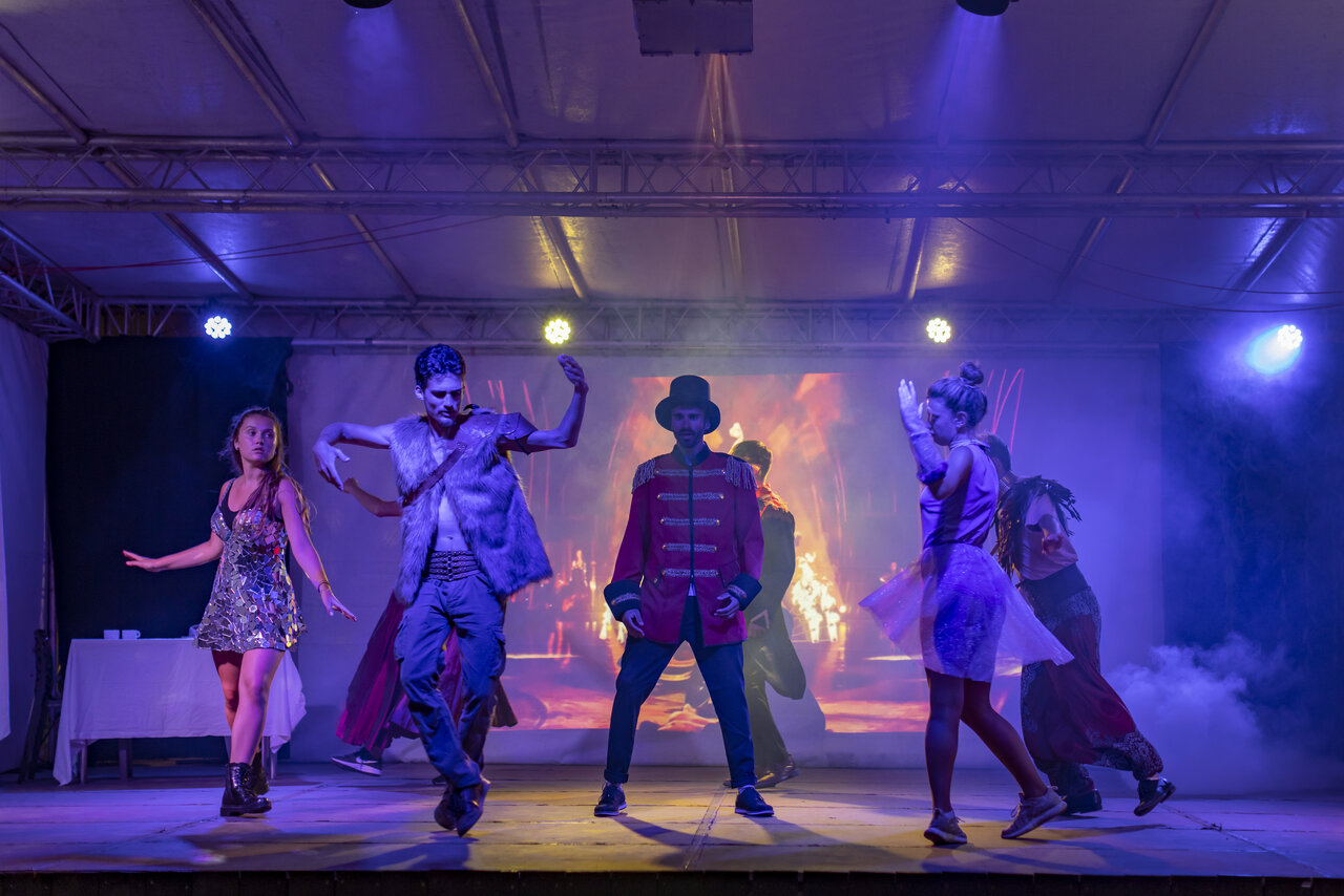 Entertainment show with costumed dancers on stage at CAPFUN Paillotte campsite in AZUR.
