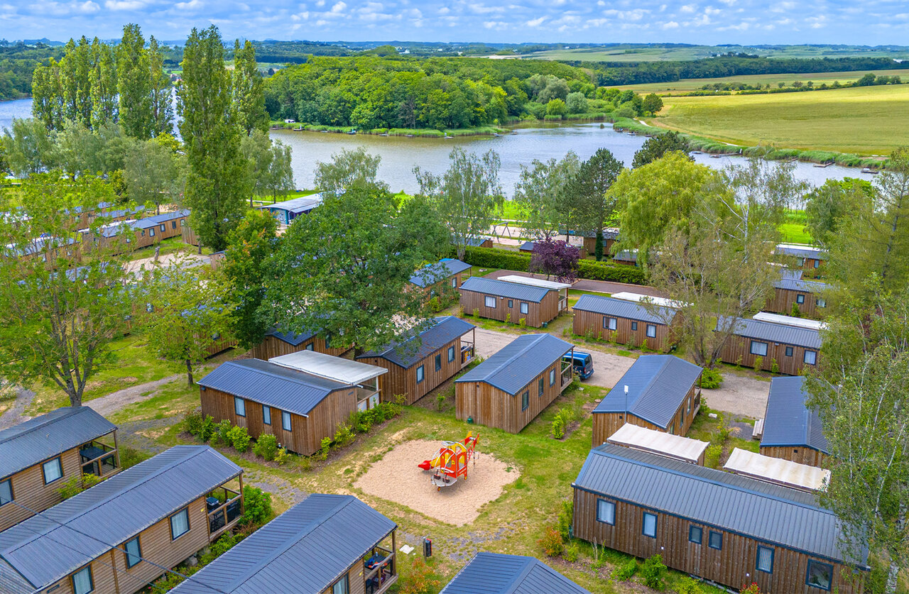 Mobile homes, playground and lake, aerial view at CAPFUN Palais de Gaufrette campsite in R�mering les Puttelange (57).