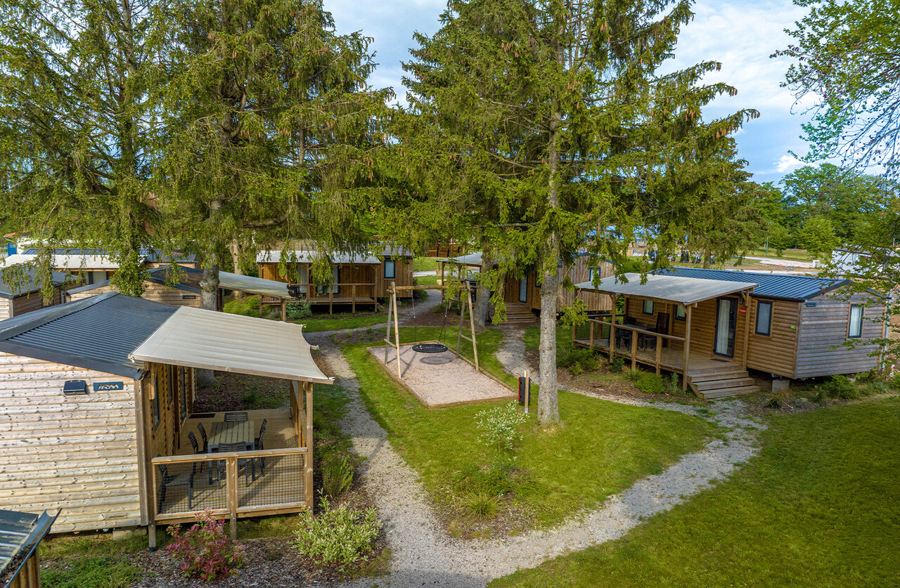 Wooden mobile homes, terraces, playground at CAPFUN Palais de Gaufrette, R�mering les Puttelange.