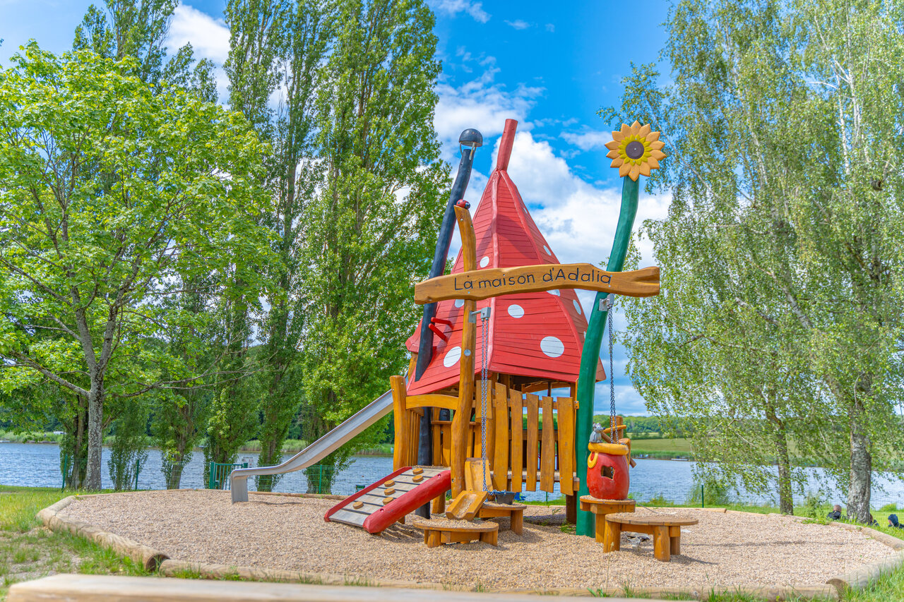 Playground, slide, lake at CAPFUN Palais de Gaufrette campsite in R�mering.