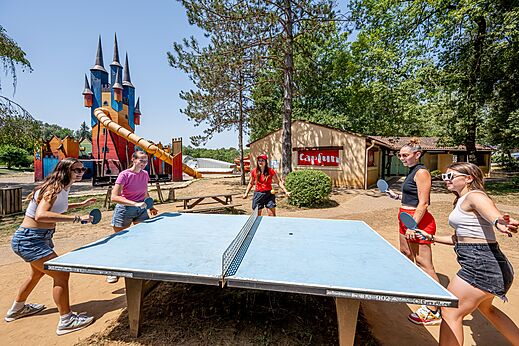 Lively ping-pong game and castle playground at CAPFUN Palombi�re campsite in SAINT-NATHALENE (24).