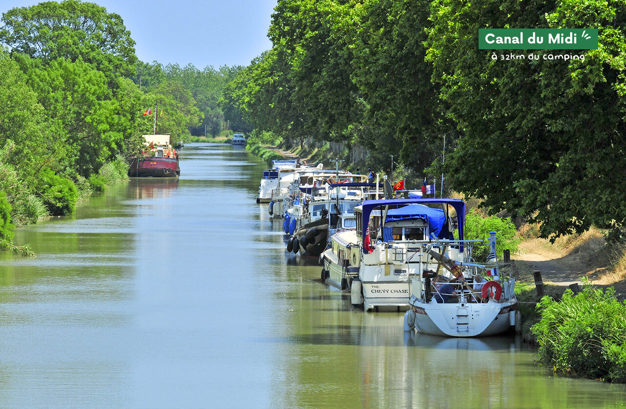 Boats moored along the Canal du Midi, tourist site near Marseillan-Plage.