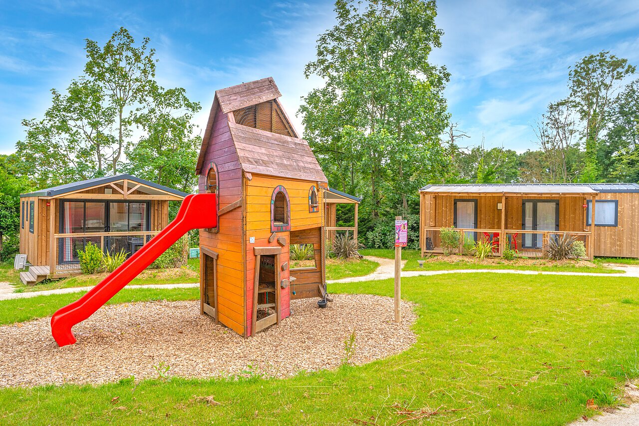 Playground with slide and Mobile homes at CAPFUN Parc de Paris campsite in Villevaud� (77).