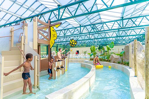 Indoor swimming pool, water games, river at CAPFUN Parc de Paris campsite Villevaud�.