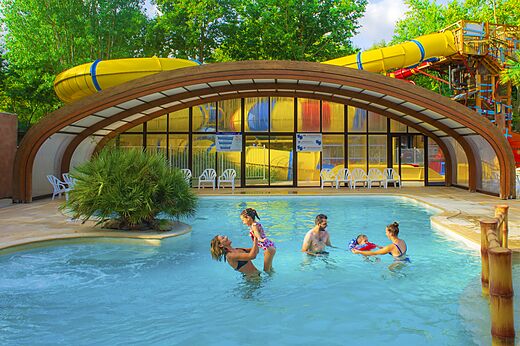 Outdoor swimming pool and water slides at CAPFUN Paris Roussillon campsite in ARGELES SUR MER.