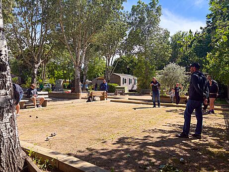 Petanque players on the court at CAPFUN Paris Roussillon campsite in ARGELES SUR MER.