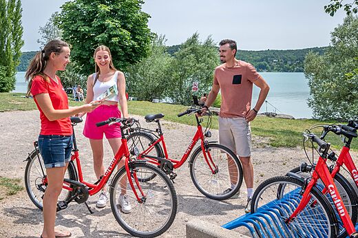 Red Capfun bikes for rent near the lake at CAPFUN Pergola campsite in Marigny.