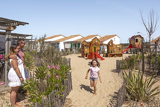 Wooden playground, slides, sand at CLICOCHIC Petit Bec campsite (85).