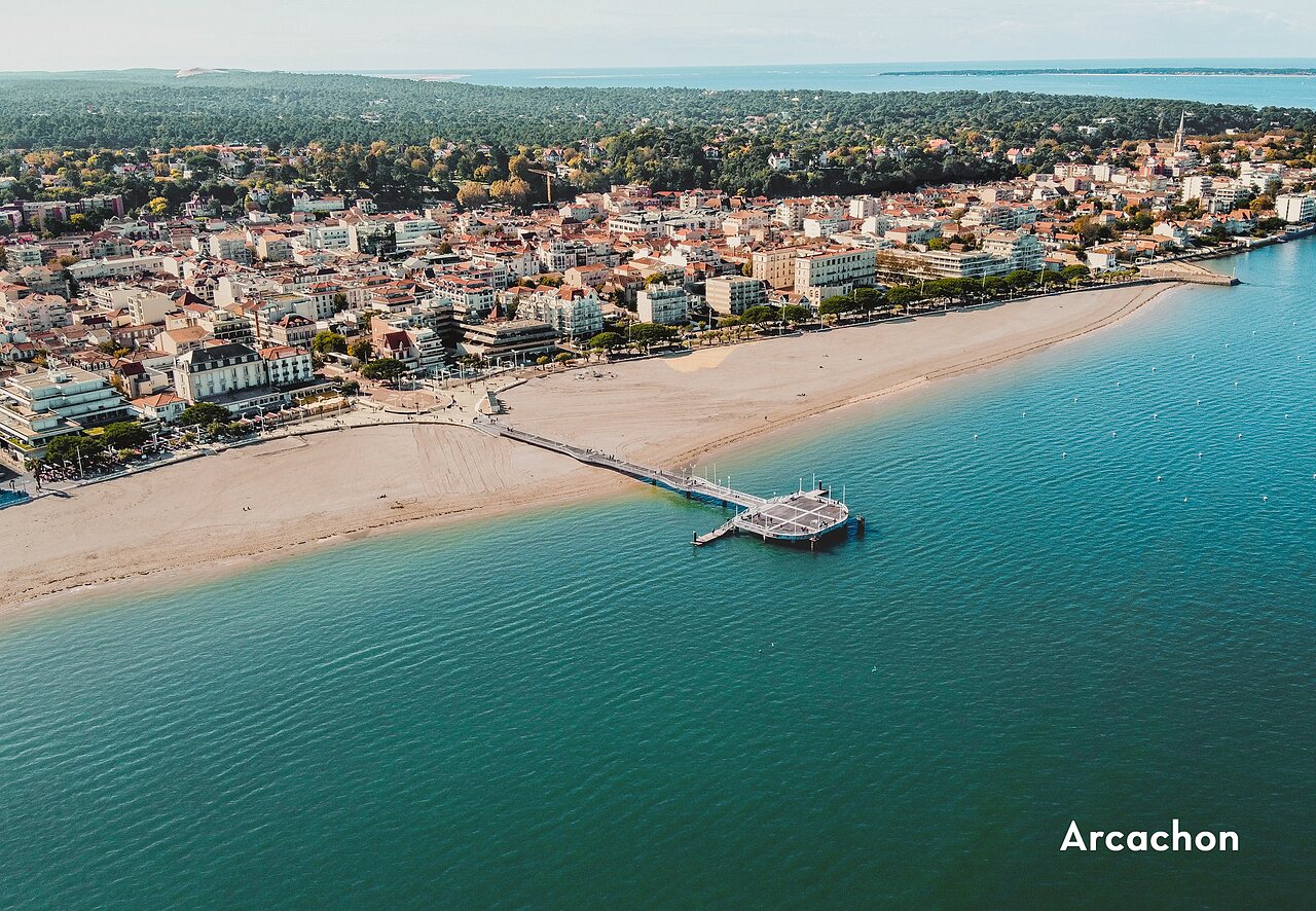 Aerial view of Arcachon, its beach, waterfront, and Thiers pier.