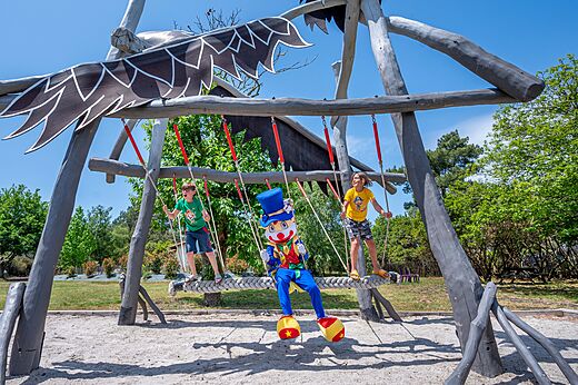Original swing set, children and mascot at CAPFUN Pin�da campsite in CAZAUX (33).