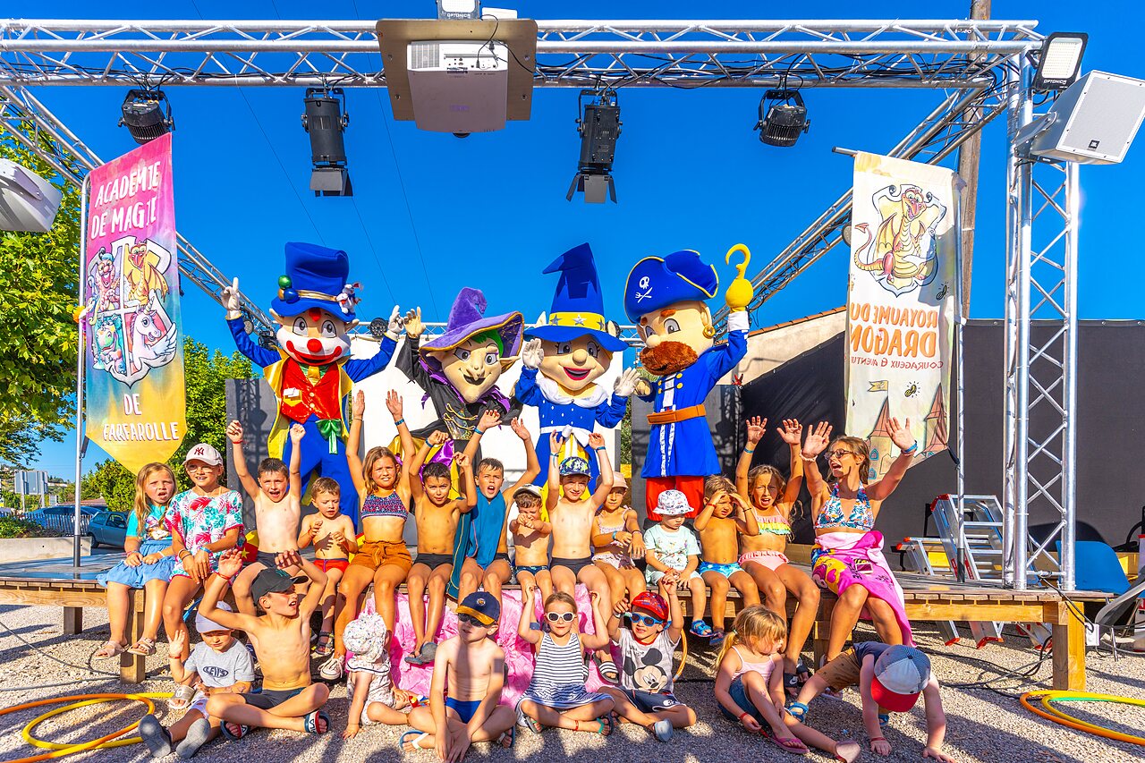 Children's entertainment with mascots on stage at CAPFUN La Pin�de de Grimaud campsite.