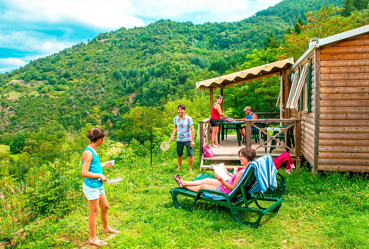 Wooden Mobile home, family and mountains at CAPFUN Plantas campsite in SAINT VINCENT DE DURFORT.