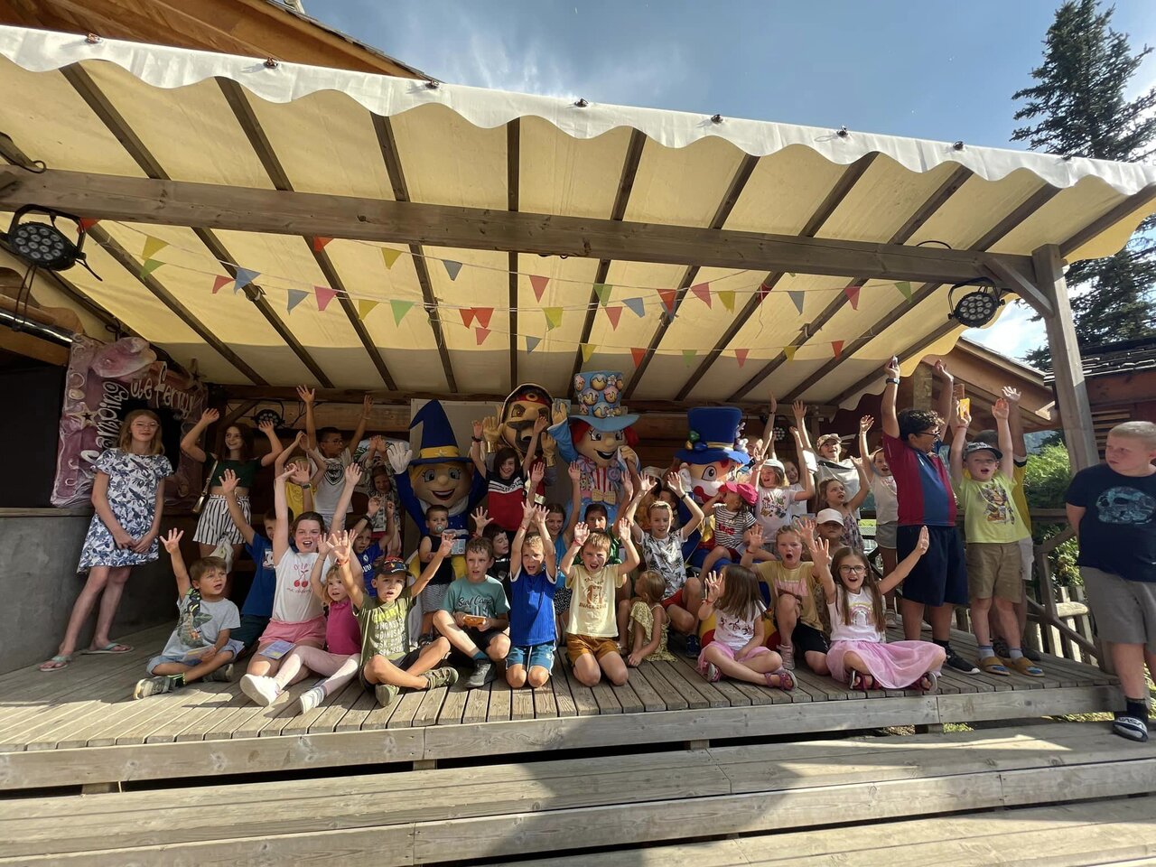 Kids and mascots on stage, entertainment at CAPFUN Plan du Fernuy campsite (74).