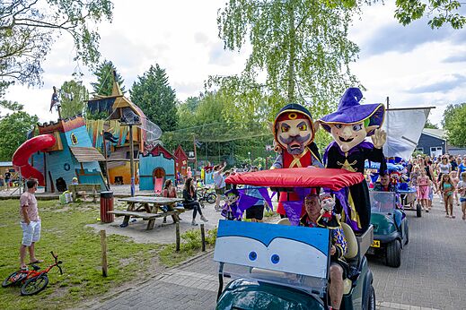 Large colorful playground and animation parade at CAPFUN Ponderosa campsite in Ulicoten.