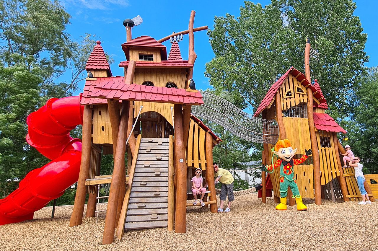 Playground with slide and mascot at CAPFUN Les Portes du Beaujolais campsite in Anse (69).