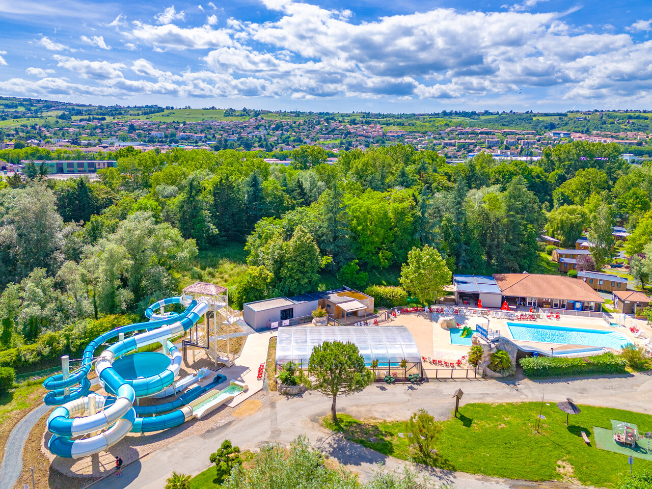 Giant waterslides, outdoor pools at CAPFUN Les Portes du Beaujolais campsite, Anse (69).